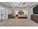 Spacious main bedroom features a seating area, carpet, and a tray ceiling at 3860 Overlake Dr, Cumming, GA 30041