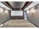 Finished media room featuring dark gray walls, spot lighting, and a large screen at 3860 Overlake Dr, Cumming, GA 30041