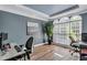 Office with wood floors, large windows, and plenty of room for multiple desks at 3860 Overlake Dr, Cumming, GA 30041