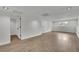 Spacious finished basement with light wood flooring, recessed lighting, and a bright window at 4735 Julian Way, Acworth, GA 30101