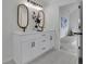 Bathroom with double sink vanity, modern lighting and wood framed mirrors at 4735 Julian Way, Acworth, GA 30101