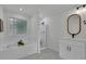 Bright bathroom features a shower, soaking tub and modern vanity at 4735 Julian Way, Acworth, GA 30101