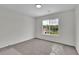 A clean bedroom with grey carpet and lots of light coming through the large window at 4735 Julian Way, Acworth, GA 30101