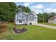 Charming home with well-manicured lawn, flower bed, two-car garage and picturesque curb appeal at 4735 Julian Way, Acworth, GA 30101