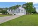 Suburban home with a two-car garage, neat landscaping, and a well-maintained green lawn at 4735 Julian Way, Acworth, GA 30101