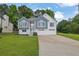 Charming two-story home with a well-manicured lawn, a two-car garage, and a welcoming front entrance at 4735 Julian Way, Acworth, GA 30101