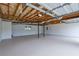 Unfinished garage with exposed ceiling fixtures shows potential for a workshop or parking space at 4735 Julian Way, Acworth, GA 30101