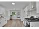 Bright, updated kitchen features quartz counters, stainless appliances and an eat-in area at 4735 Julian Way, Acworth, GA 30101