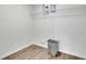 Neutral laundry room features wood look floors and wire shelving at 4735 Julian Way, Acworth, GA 30101