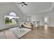 Bright, open living room with fireplace, vaulted ceiling, and a view of the backyard at 4735 Julian Way, Acworth, GA 30101