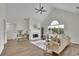 Open living room with vaulted ceiling, fireplace, hardwood floors and contemporary decor at 4735 Julian Way, Acworth, GA 30101