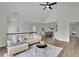 Spacious living room with a vaulted ceiling, hardwood floors, and an adjoining dining area at 4735 Julian Way, Acworth, GA 30101