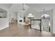 Bright living room features vaulted ceilings, fireplace, and elegant staircase with natural light at 4735 Julian Way, Acworth, GA 30101