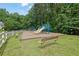Community playground with slides, benches, and a fenced perimeter is great for children to play at 4735 Julian Way, Acworth, GA 30101