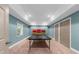 Recreational basement area featuring a ping pong table, neutral carpeting and recessed lighting at 7049 Bennington Ln, Cumming, GA 30041