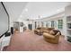 Spacious finished basement with home theater setup, plush carpet, and ample seating at 7049 Bennington Ln, Cumming, GA 30041