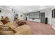 Finished basement with a large seating area, media screen and plush carpeting at 7049 Bennington Ln, Cumming, GA 30041