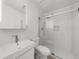 This bathroom features subway tile in the shower, a glass shower door, and a floating vanity at 7049 Bennington Ln, Cumming, GA 30041