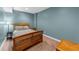 Cozy bedroom with carpet, natural light, and comfortable furnishings at 7049 Bennington Ln, Cumming, GA 30041