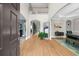 Bright foyer with hardwood floors, high ceilings, and an open view to living spaces at 7049 Bennington Ln, Cumming, GA 30041