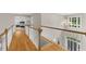 Second story hallway with views to first floor and entrance at 7049 Bennington Ln, Cumming, GA 30041