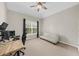 Bright office space with desk and seating, bathed in natural light from the window at 7049 Bennington Ln, Cumming, GA 30041