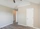 Small bedroom with neutral walls, wood-look flooring and a standard sized closet at 1932 Sawgrass Dr, Hampton, GA 30228