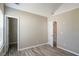 This bedroom features neutral walls, wood-look flooring and a walk-in closet at 1932 Sawgrass Dr, Hampton, GA 30228