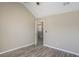 This bedroom features neutral walls, wood-look flooring and a vaulted ceiling at 1932 Sawgrass Dr, Hampton, GA 30228