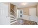 Welcoming entryway featuring wood floors, fresh paint, stairs, and white trim at 1932 Sawgrass Dr, Hampton, GA 30228