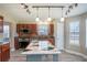 Modern kitchen with island, stainless steel appliances, dark cabinetry, and trendy backsplash at 1932 Sawgrass Dr, Hampton, GA 30228