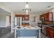 Modern kitchen with stainless appliances, island, and wood floors at 1932 Sawgrass Dr, Hampton, GA 30228