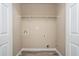This spacious laundry room has neutral paint and vinyl floors at 1932 Sawgrass Dr, Hampton, GA 30228