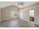 Spacious main bedroom with vaulted ceilings, a ceiling fan, and a connected bathroom at 1932 Sawgrass Dr, Hampton, GA 30228