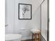 Framed art accents the bathroom and its modern, minimalist decor at 227 Ivey Ter, Temple, GA 30179