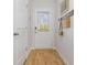 Inviting entryway with wood-look flooring, coat hooks, and a door with window at 227 Ivey Ter, Temple, GA 30179