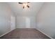 This bedroom is highlighted by neutral walls, vaulted ceilings, and carpet at 2557 Woodford Ln, Buford, GA 30519