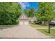 Charming two-story home featuring a well-maintained lawn and a convenient two-car garage at 2557 Woodford Ln, Buford, GA 30519