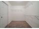 Walk-in closet with wire shelving at 2557 Woodford Ln, Buford, GA 30519