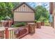 Backyard wooden deck with stone pillars and an exterior view of the home at 3044 Dogwood Dr, Atlanta, GA 30354