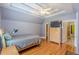 Bedroom with hardwood floors, trey ceiling, and view of ensuite at 3044 Dogwood Dr, Atlanta, GA 30354