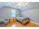 Inviting bedroom with hardwood floors, ceiling fan, and a window with natural light at 3044 Dogwood Dr, Atlanta, GA 30354