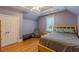 Cozy bedroom with tray ceiling, hardwood floors, and a serene color scheme at 3044 Dogwood Dr, Atlanta, GA 30354
