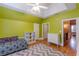 Brightly painted upstairs bedroom with hardwood floors and a ceiling fan at 3044 Dogwood Dr, Atlanta, GA 30354