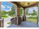 Spacious front porch with stone support columns and a charming view of the neighborhood street at 3044 Dogwood Dr, Atlanta, GA 30354