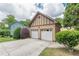 Two-car detached garage featuring neutral siding, decorative shingles, and a concrete driveway at 3044 Dogwood Dr, Atlanta, GA 30354