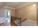 Upstairs hallway with hardwood floors leading to a bedroom at 3044 Dogwood Dr, Atlanta, GA 30354