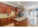 Traditional kitchen featuring cherry cabinets, granite countertops, and stainless steel appliances at 3044 Dogwood Dr, Atlanta, GA 30354