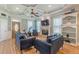 Cozy living room with a fireplace, built-in shelving, and a decorative tray ceiling at 3044 Dogwood Dr, Atlanta, GA 30354