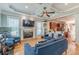 Inviting living room open to kitchen featuring a cozy fireplace and modern decor at 3044 Dogwood Dr, Atlanta, GA 30354